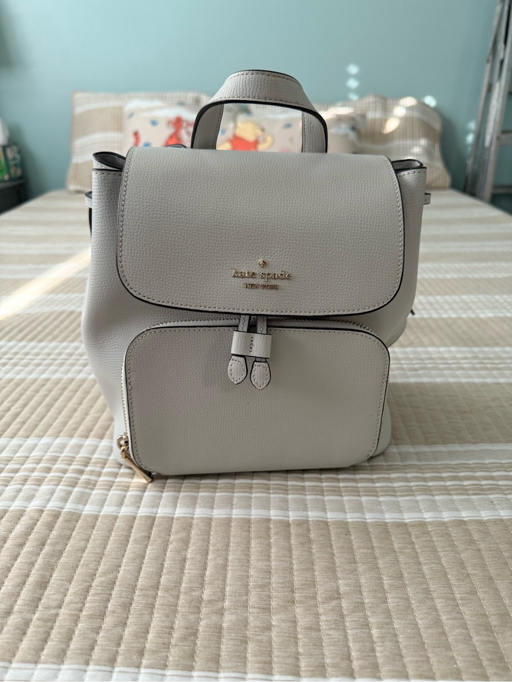 kate spade pebble leather mini backpack in light beige